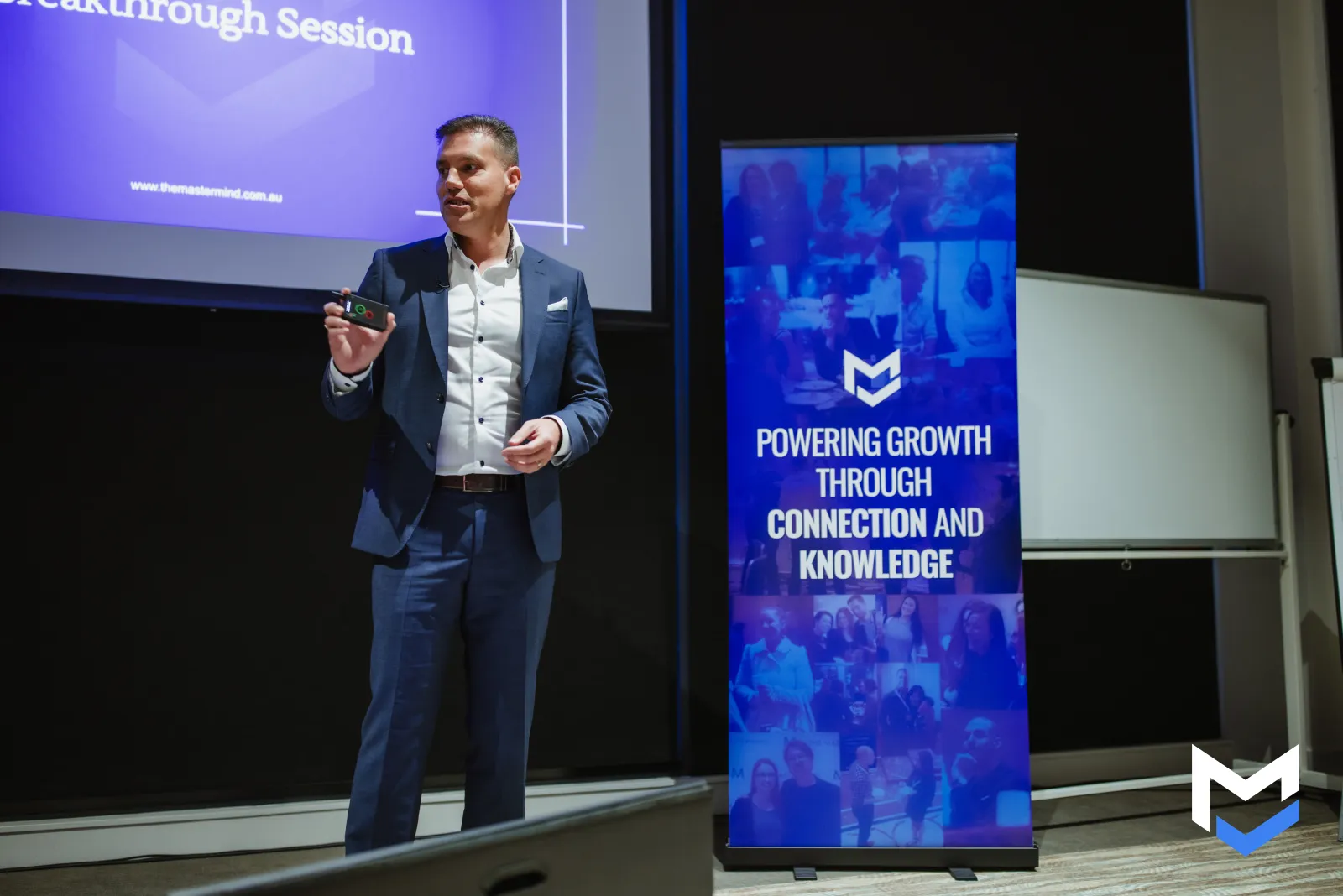 Ben presenting with Mastermind banner